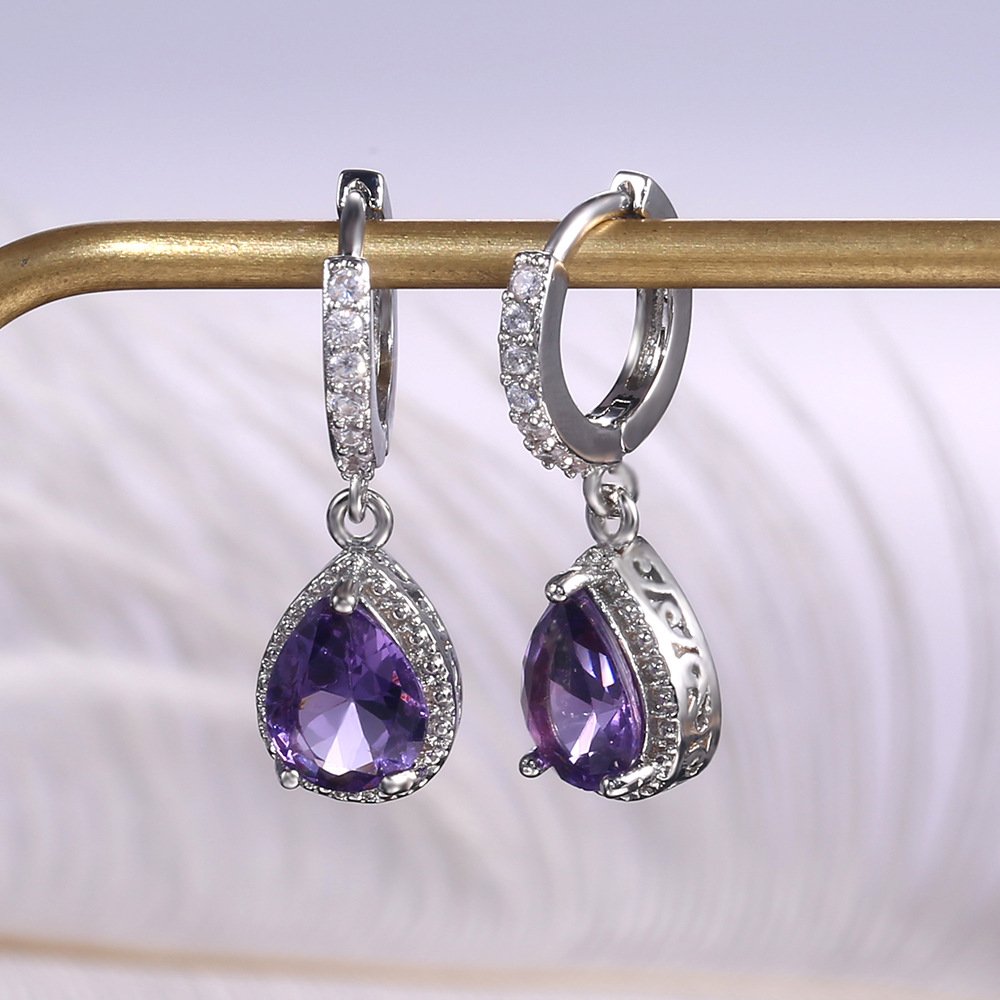 Prong set purple gemstone earrings