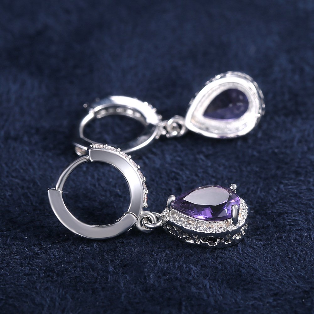Prong set purple gemstone earrings