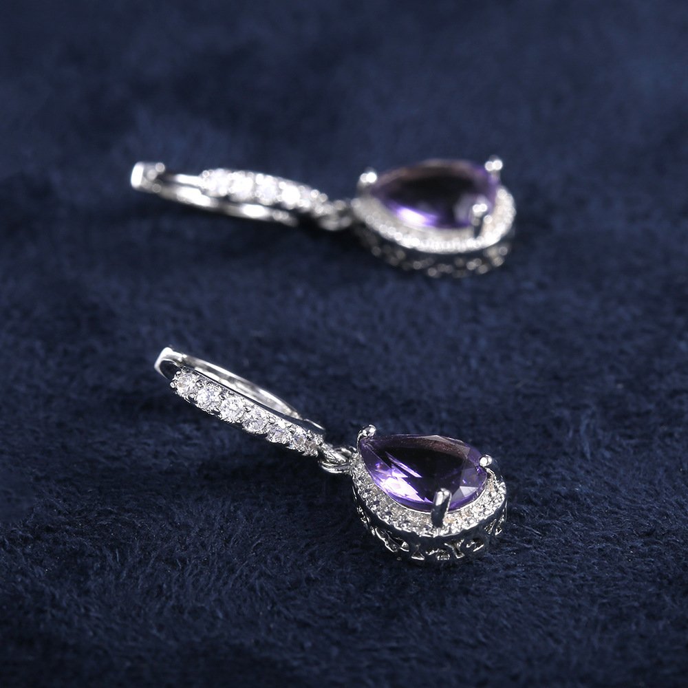 Prong set purple gemstone earrings